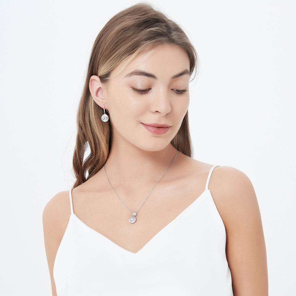 Model wearing 2-Stone Cable Bezel Set CZ Necklace and Earrings Set in Sterling Silver