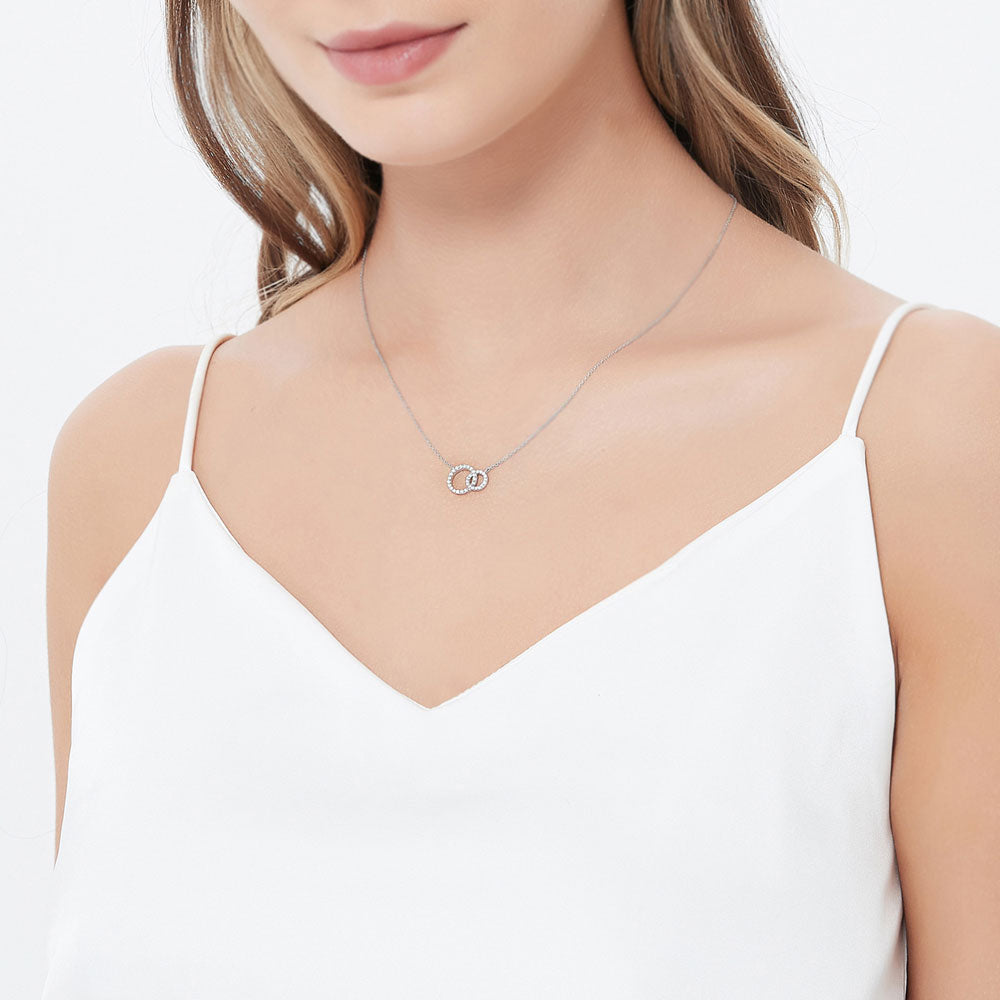 Model wearing Open Circle Interlocking CZ Pendant Necklace in Sterling Silver