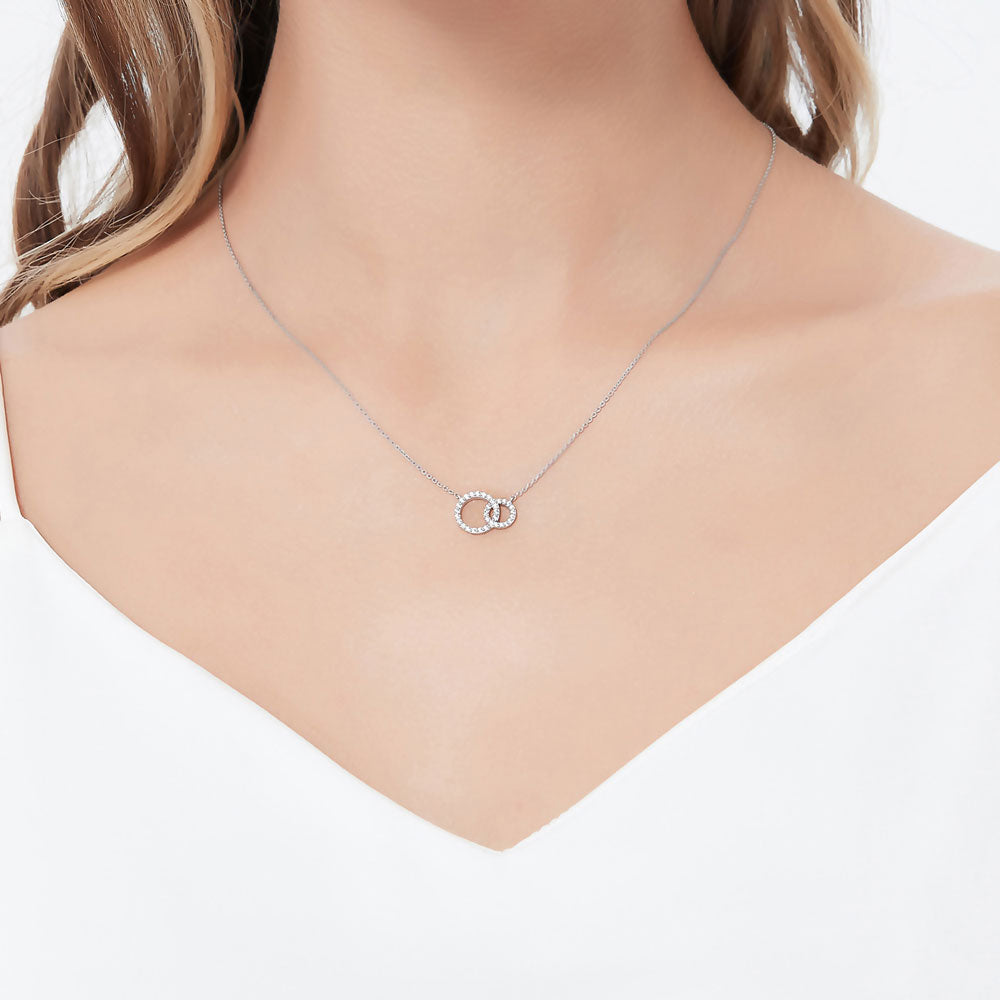 Model wearing Open Circle Interlocking CZ Pendant Necklace in Sterling Silver