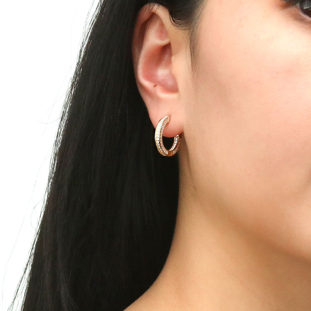 Model wearing Bar CZ Medium Inside-Out Hoop Earrings in Sterling Silver 0.75 inch