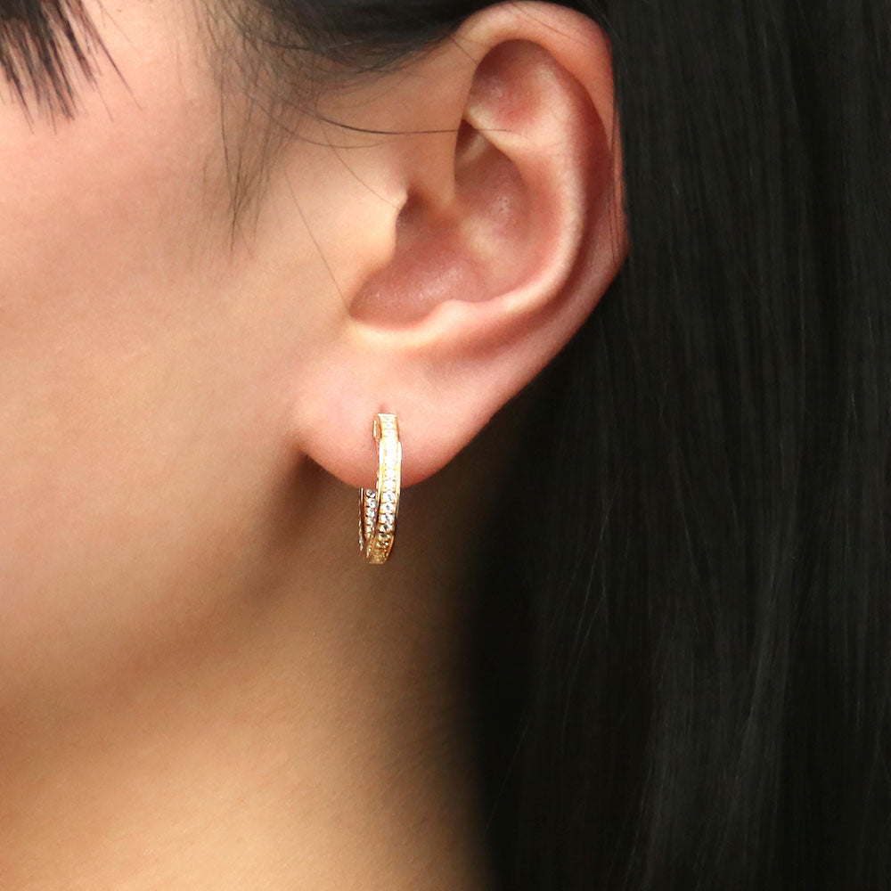 Model wearing Bar CZ Medium Inside-Out Hoop Earrings in Sterling Silver 0.75 inch