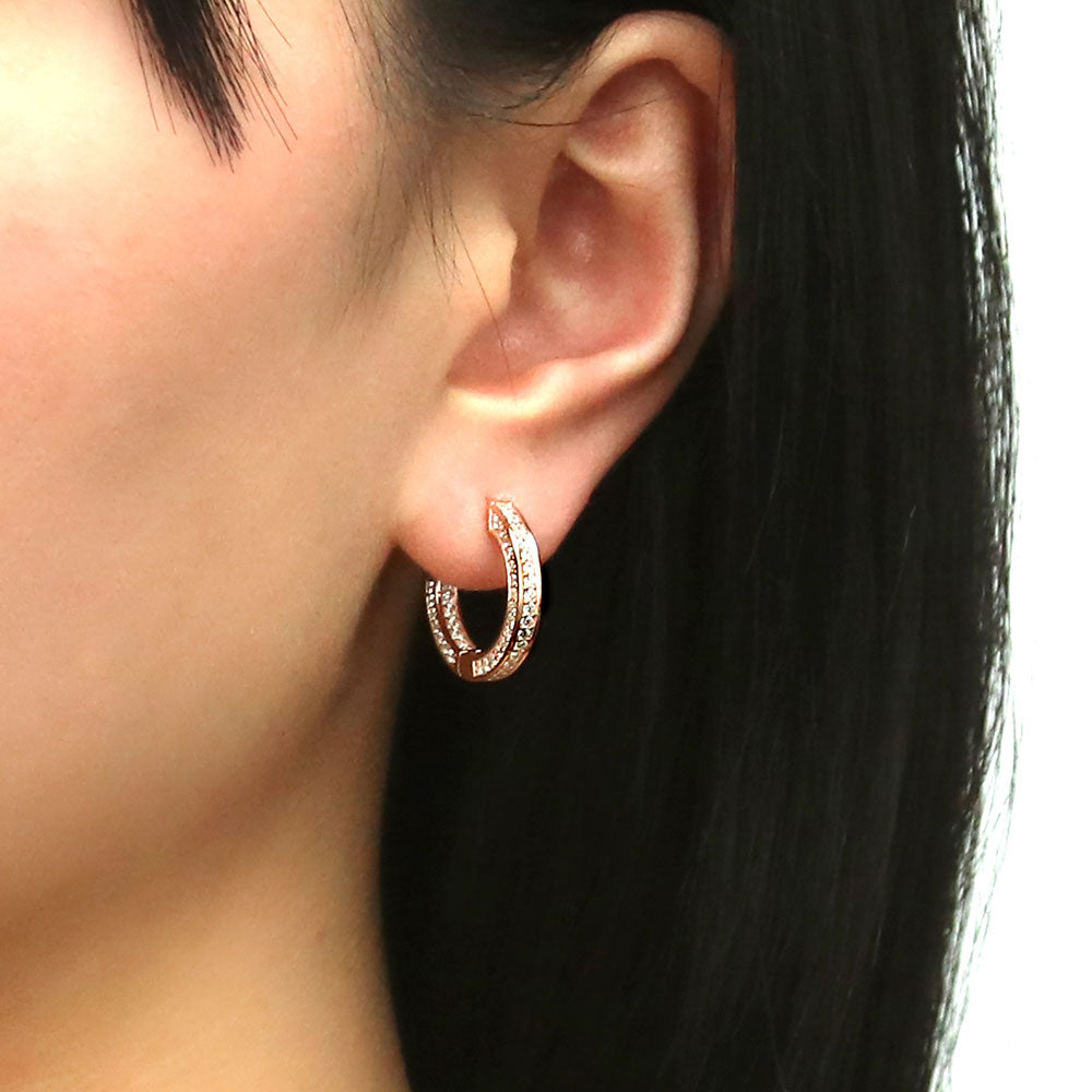 Model wearing Bar CZ Medium Inside-Out Hoop Earrings in Sterling Silver 0.75 inch