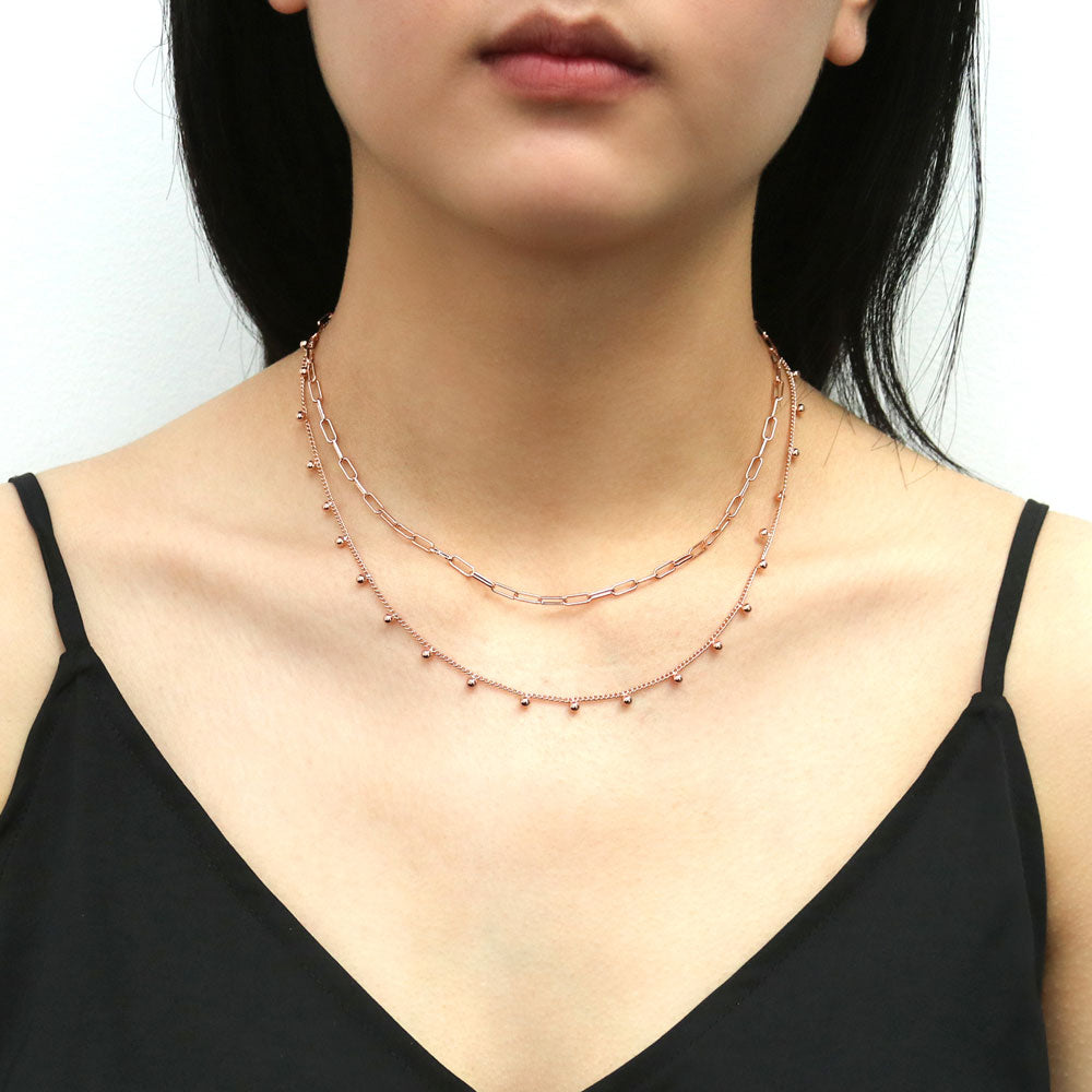 Model wearing Paperclip Bead Chain Necklace in Rose Gold Flashed Base Metal, 2 Piece
