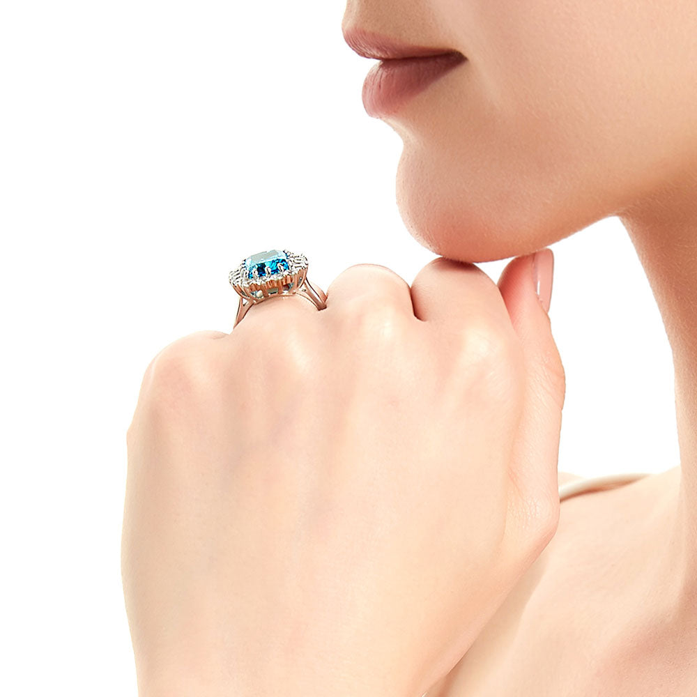 Model wearing Halo Blue Cushion CZ Statement Ring in Sterling Silver