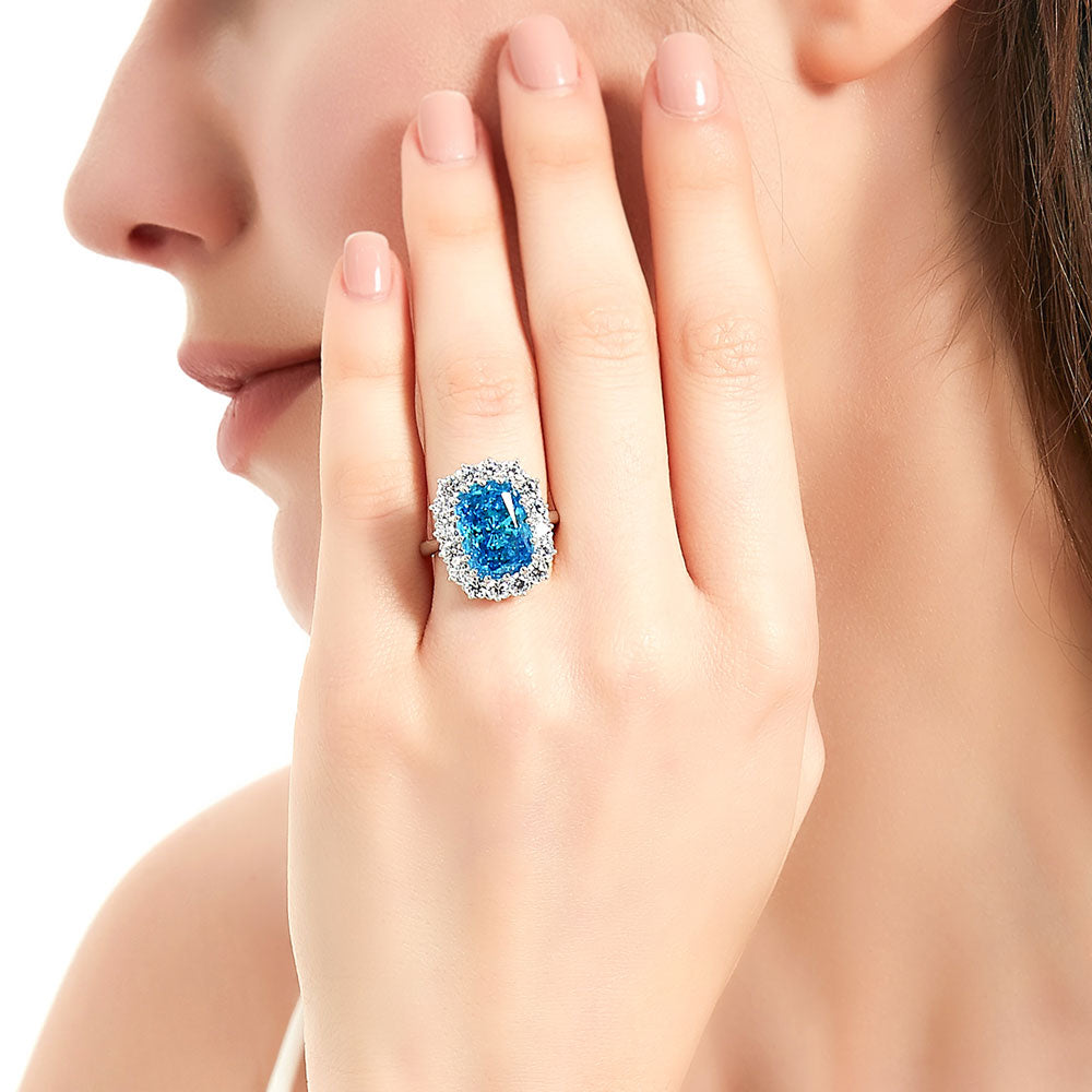 Model wearing Halo Blue Cushion CZ Statement Ring in Sterling Silver