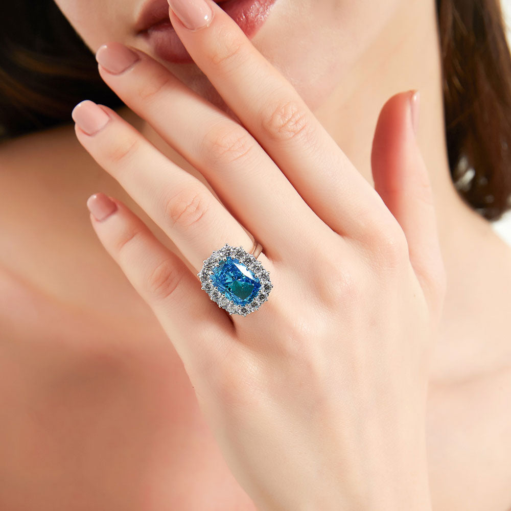 Model wearing Halo Blue Cushion CZ Statement Ring in Sterling Silver