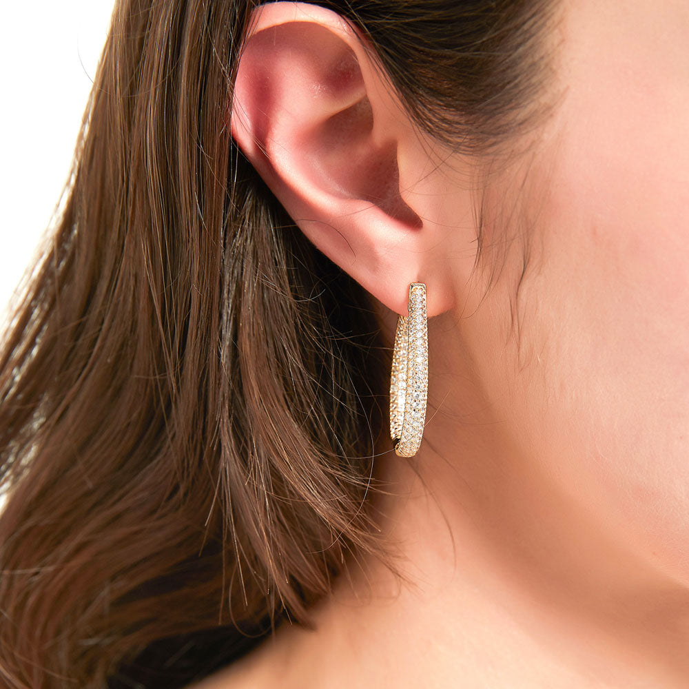 Model wearing Teardrop CZ Medium Inside-Out Hoop Earrings in Sterling Silver 1.25 inch, 2 of 6