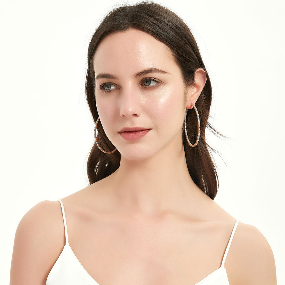 Model wearing CZ Large Inside-Out Hoop Earrings in Sterling Silver 2.5 inch