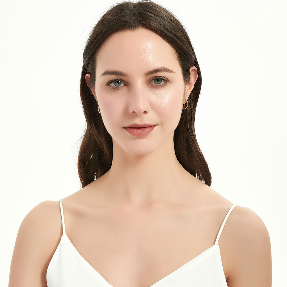 Model wearing Small Hoop Earrings in Sterling Silver 0.58 inch