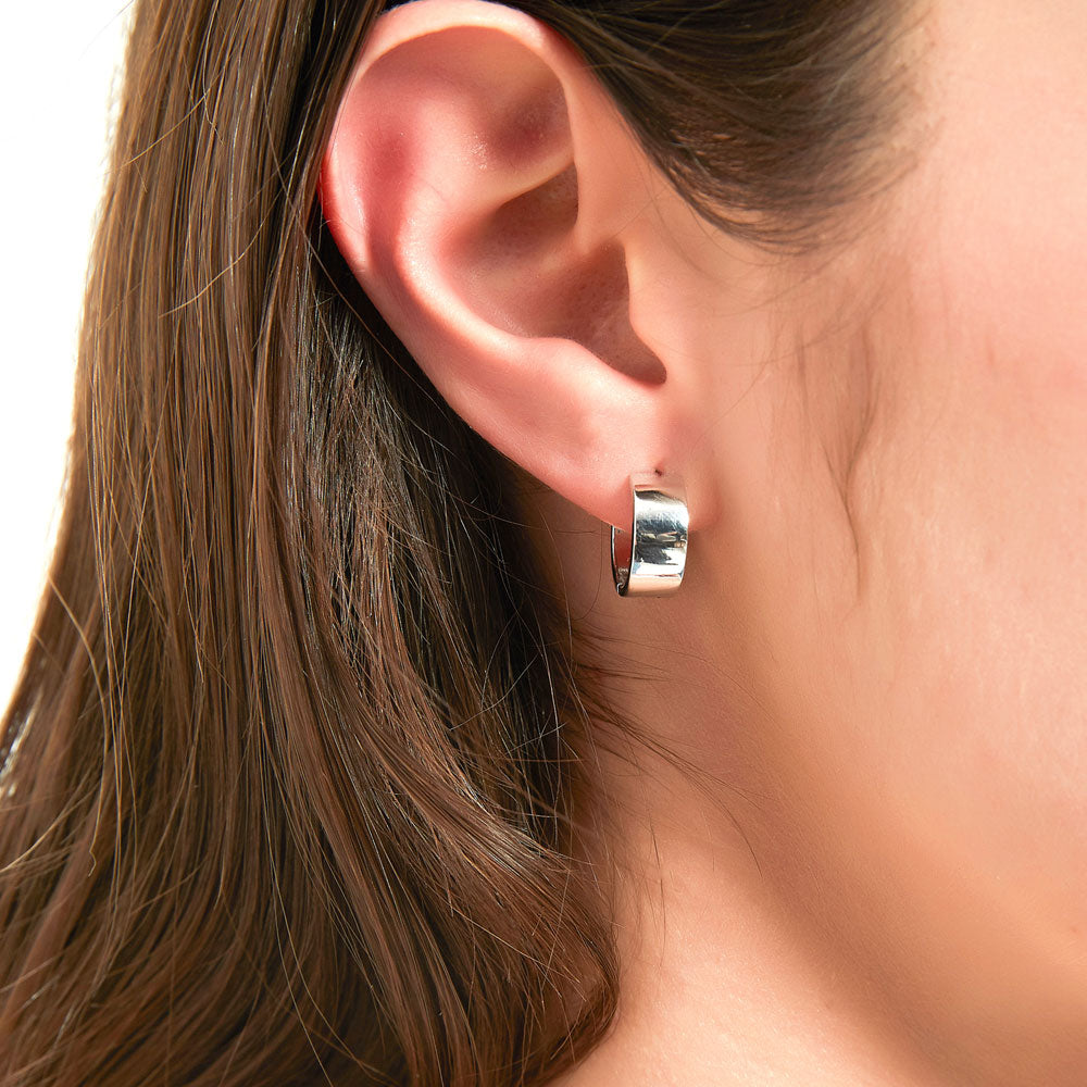 Model wearing Small Huggie Earrings in Sterling Silver 0.55 inch