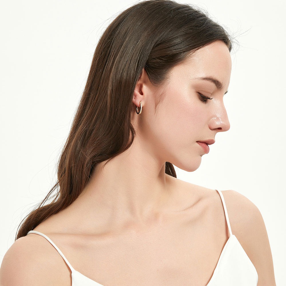 Model wearing Oval Bar CZ Medium Hoop Earrings in Sterling Silver 0.65 inch