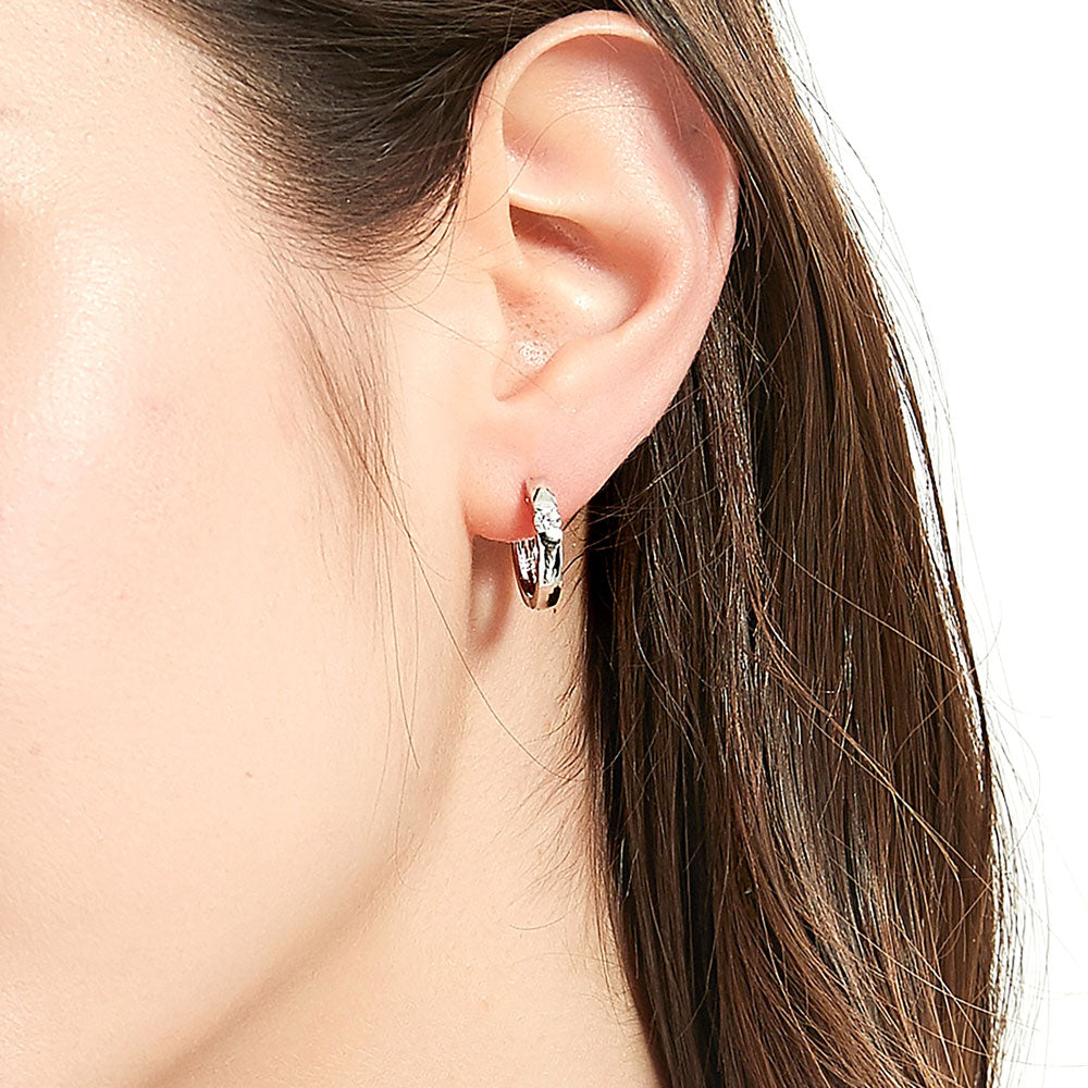 Model wearing Solitaire Round CZ Medium Hoop Earrings in Sterling Silver 0.22ct 0.64 inch, 5 of 10