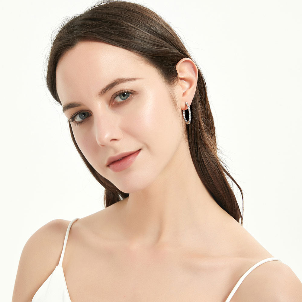 Model wearing CZ Medium Inside-Out Hoop Earrings in Sterling Silver 1 inch