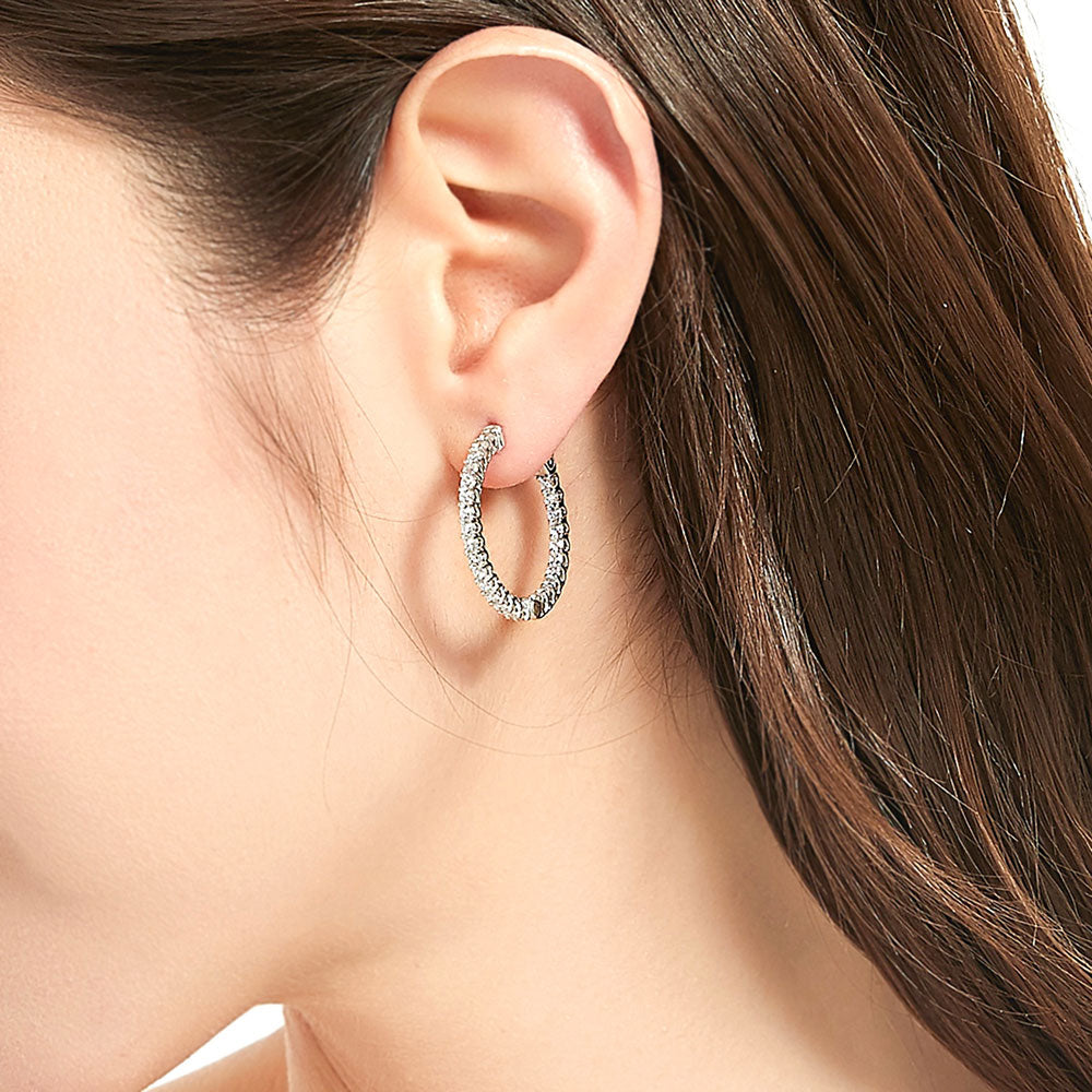 Model wearing CZ Medium Inside-Out Hoop Earrings in Sterling Silver 1 inch