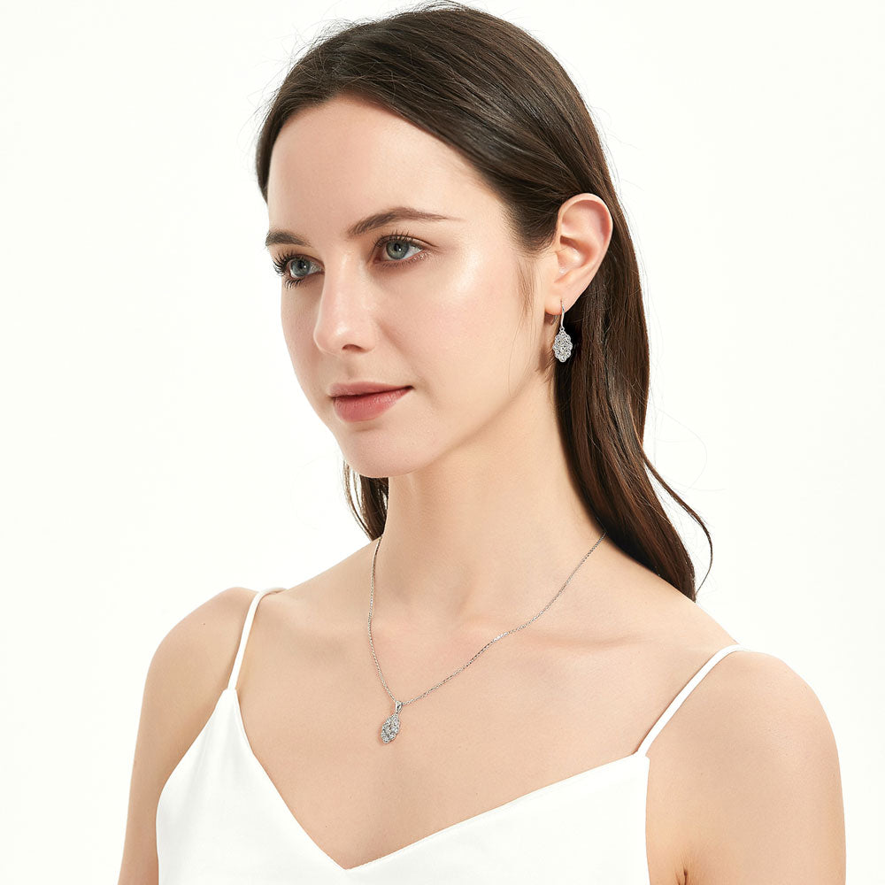 Model wearing Halo Navette Marquise CZ Necklace and Earrings Set in Sterling Silver