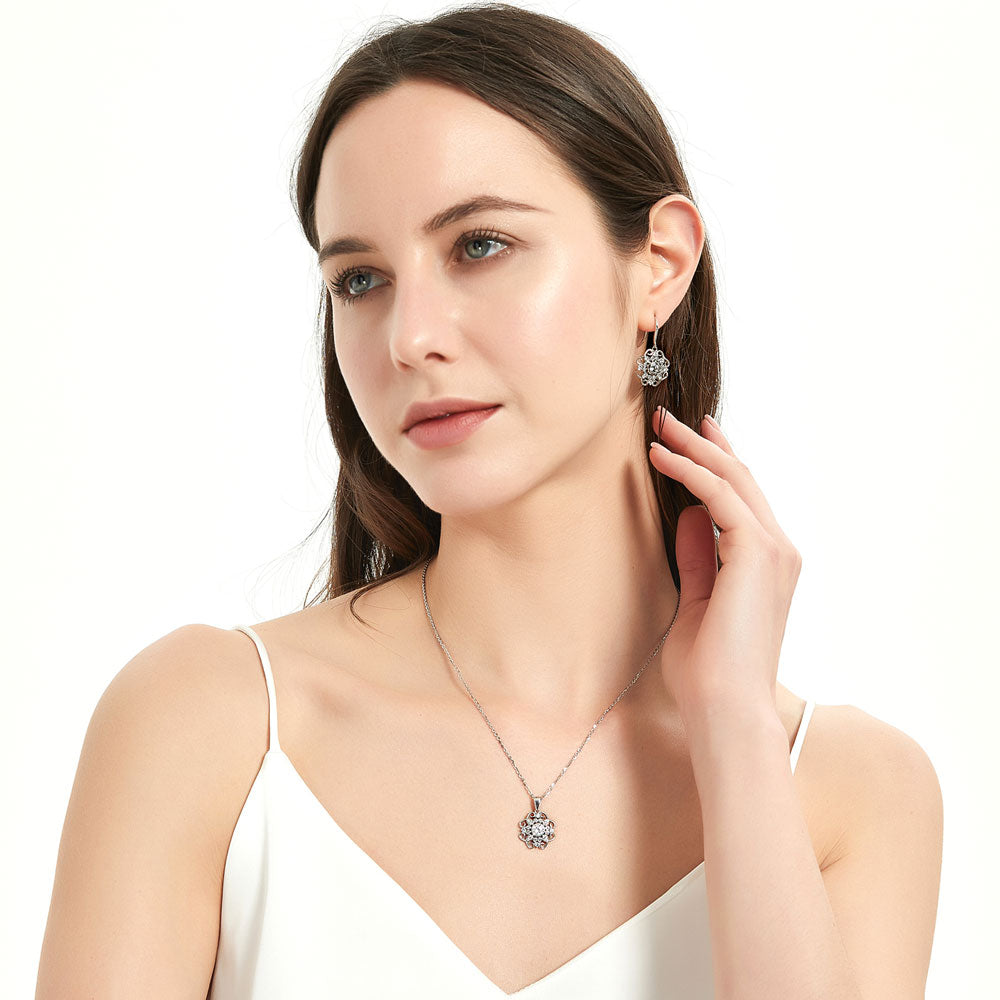 Model wearing Flower Halo CZ Necklace and Earrings Set in Sterling Silver