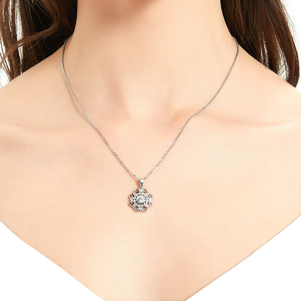 Model wearing Flower Halo CZ Pendant Necklace in Sterling Silver