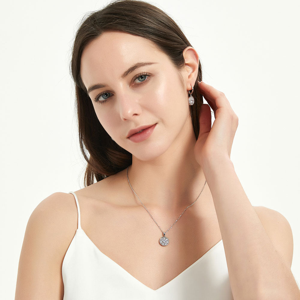 Model wearing Flower Halo CZ Necklace and Earrings Set in Sterling Silver, 3 of 10