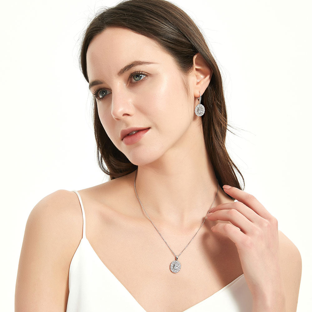 Model wearing Halo Art Deco Oval CZ Necklace and Earrings Set in Sterling Silver