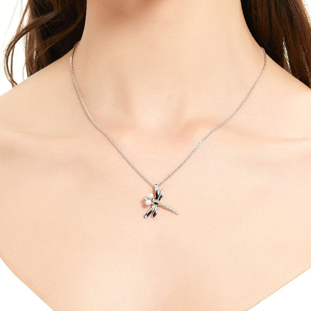 Model wearing Dragonfly White Button Cultured Pearl Necklace in Sterling Silver