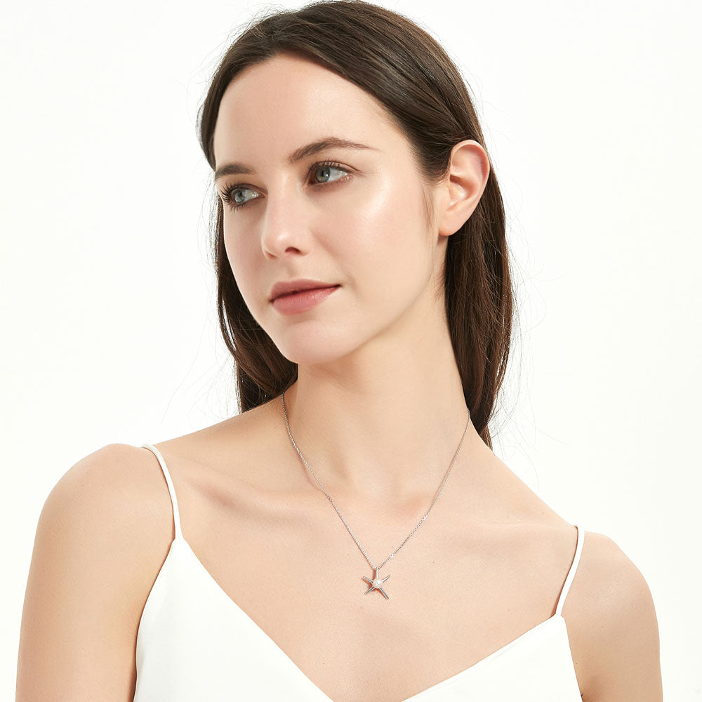 Model wearing Starfish White Button Cultured Pearl Necklace in Sterling Silver