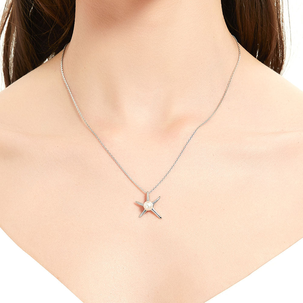 Model wearing Starfish White Button Cultured Pearl Necklace in Sterling Silver