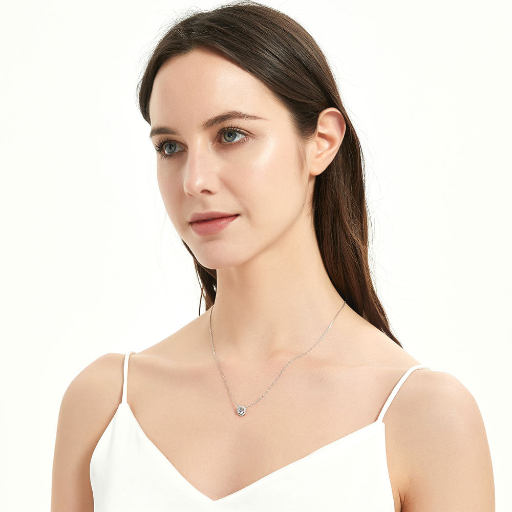 Model wearing Halo Round CZ Pendant Necklace in Sterling Silver, 3 of 8
