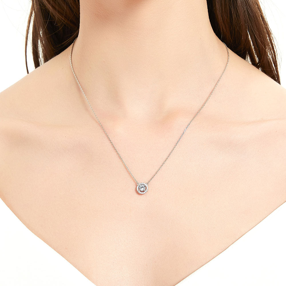 Model wearing Halo Round CZ Pendant Necklace in Sterling Silver, 2 of 8