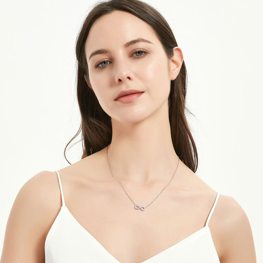 Model wearing Infinity CZ Pendant Necklace in Sterling Silver, 3 of 6
