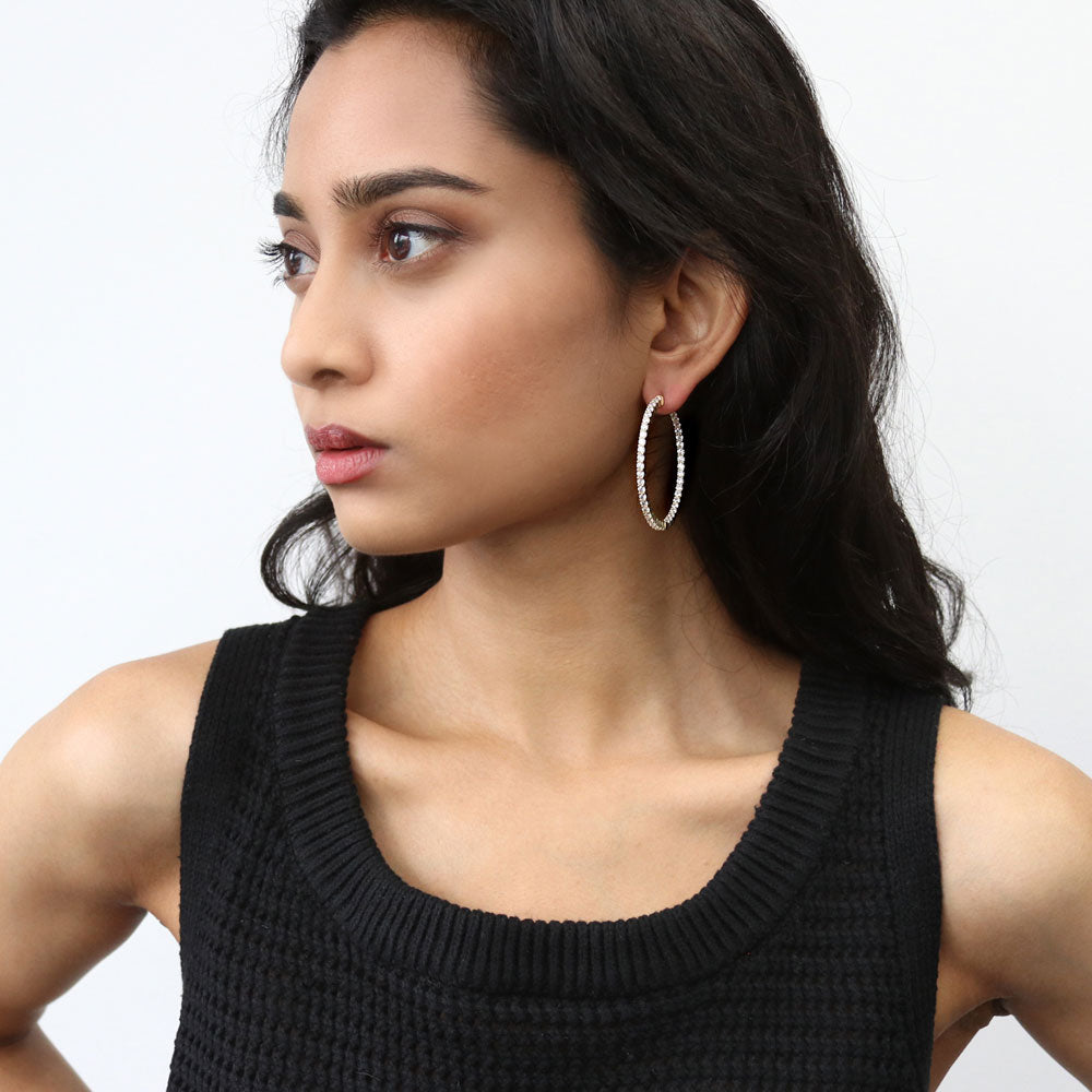 Model wearing CZ Large Inside-Out Hoop Earrings in Sterling Silver 1.8 inch