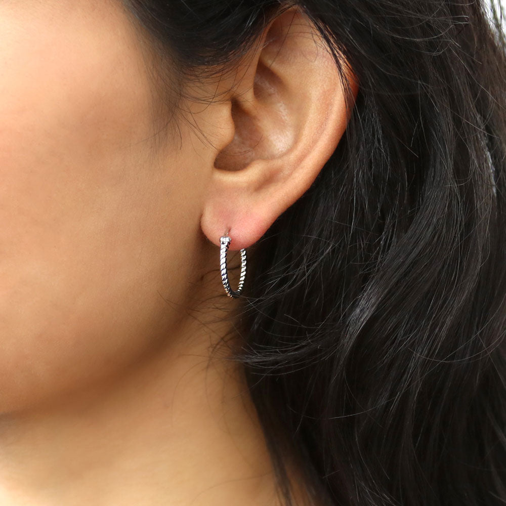 Model wearing Cable Medium Hoop Earrings in Sterling Silver 0.68 inch