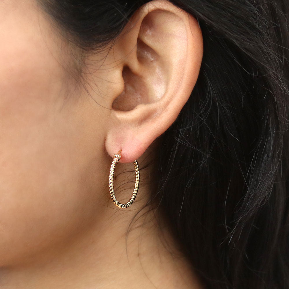 Model wearing Cable Medium Hoop Earrings in Sterling Silver 0.88 inch