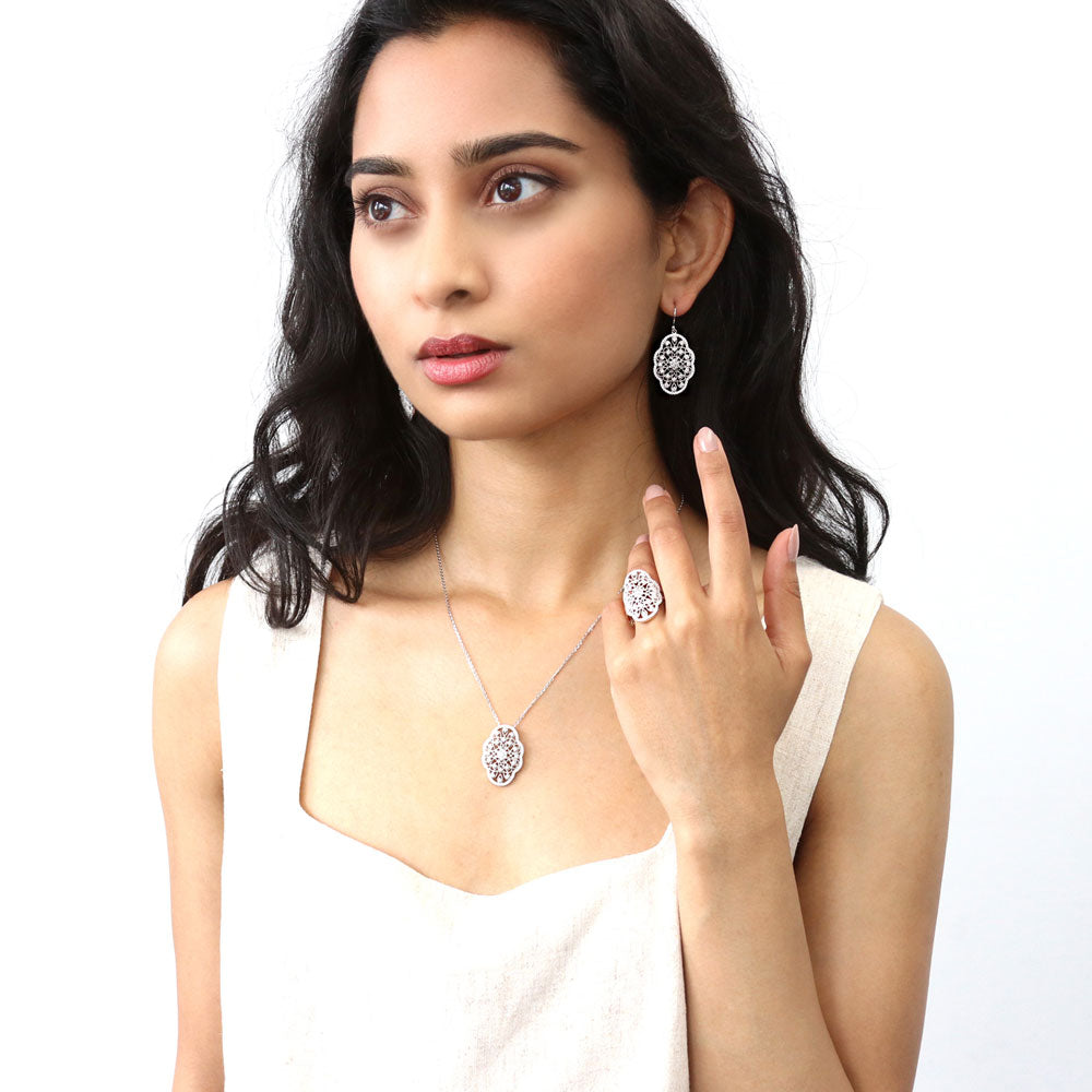 Model wearing Flower Milgrain CZ Statement Fish Hook Earrings in Sterling Silver