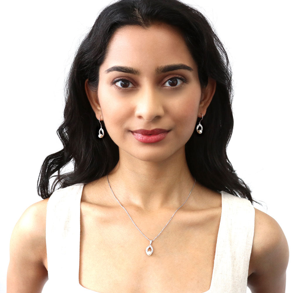 Model wearing Woven Imitation Pearl Fish Hook Dangle Earrings in Sterling Silver