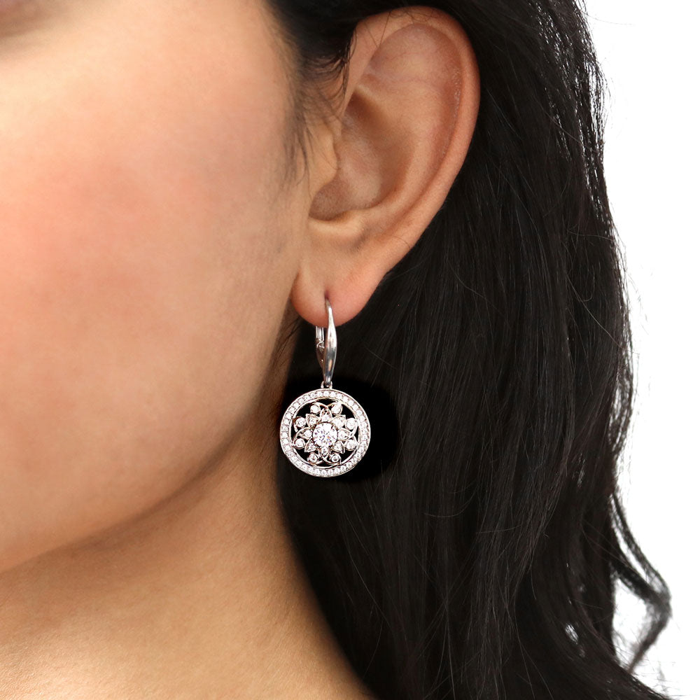 Model wearing Flower Medallion CZ Leverback Dangle Earrings in Sterling Silver