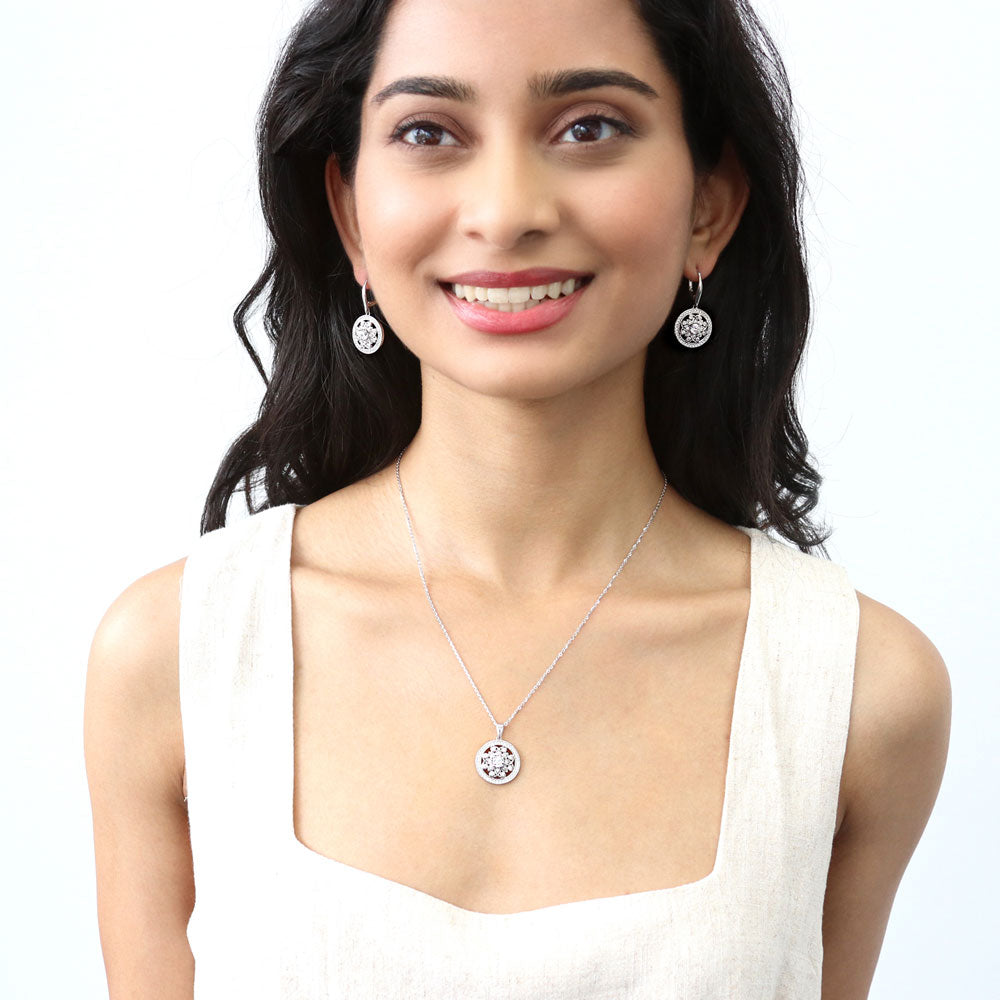 Model wearing Flower Medallion CZ Leverback Dangle Earrings in Sterling Silver