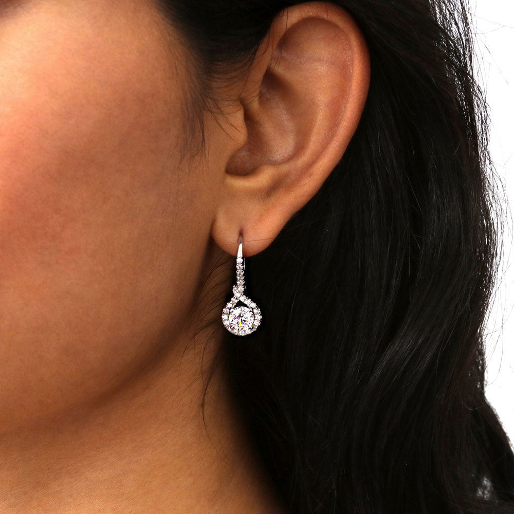 Model wearing Halo Woven Round CZ Leverback Dangle Earrings in Sterling Silver