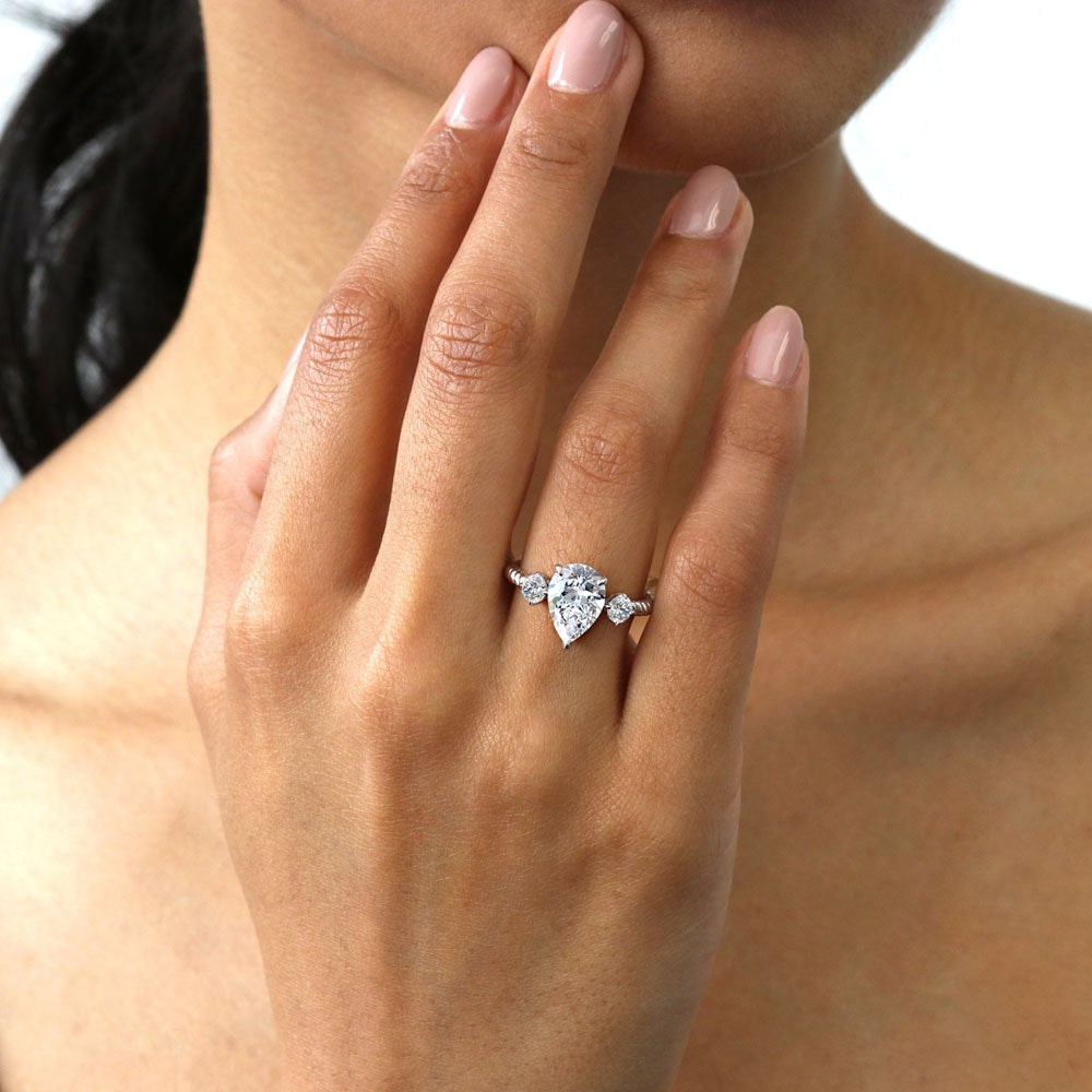 Model wearing 3-Stone Woven Pear CZ Ring in Sterling Silver