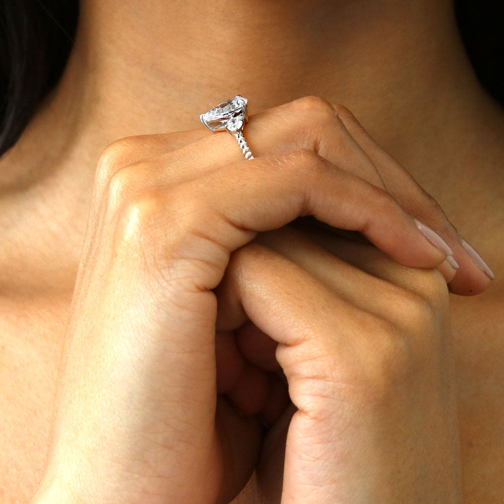 Model wearing 3-Stone Woven Pear CZ Ring in Sterling Silver