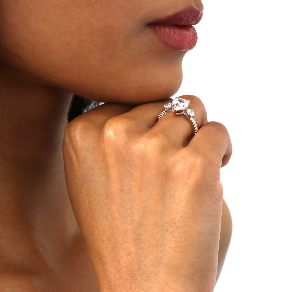 Model wearing 3-Stone Woven Pear CZ Ring in Sterling Silver