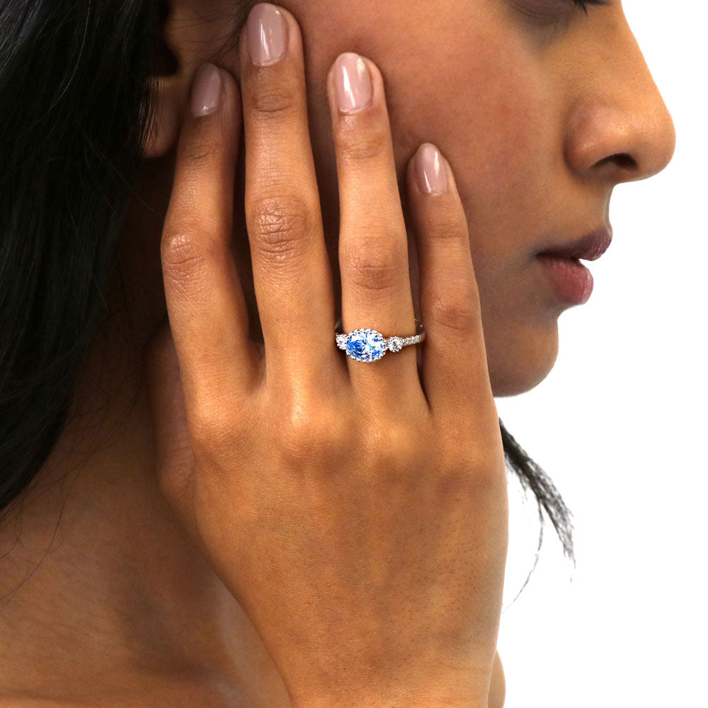 Model wearing 3-Stone Greyish Blue Oval CZ Ring in Sterling Silver, 2 of 9