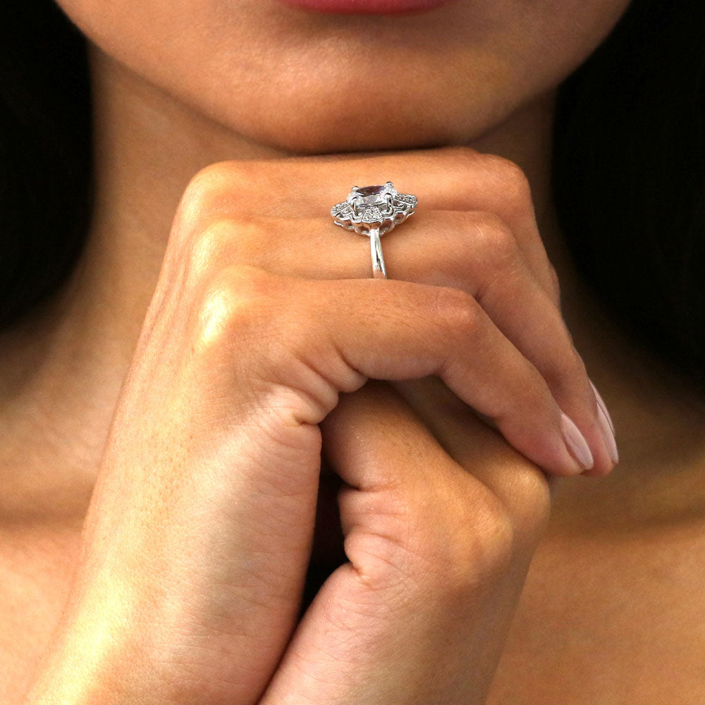 Model wearing Halo Flower Oval CZ Ring in Sterling Silver