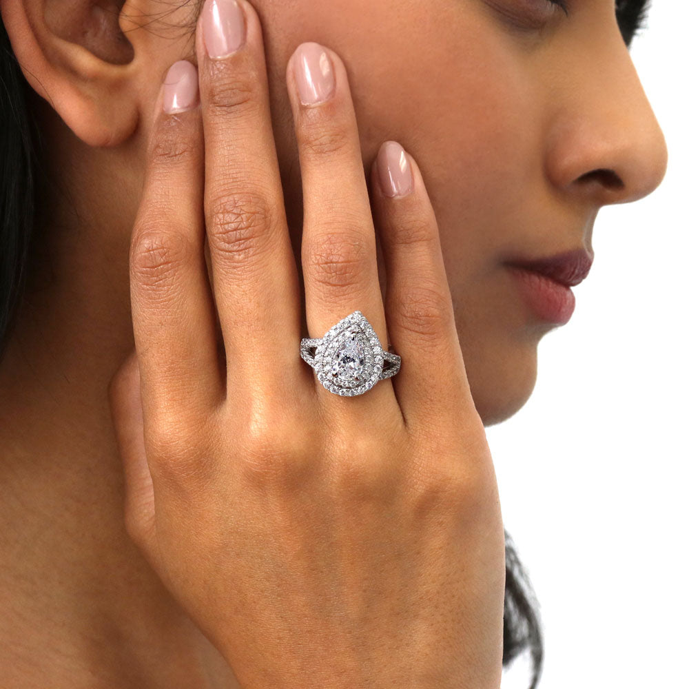 Model wearing Halo Pear CZ Statement Split Shank Ring in Sterling Silver