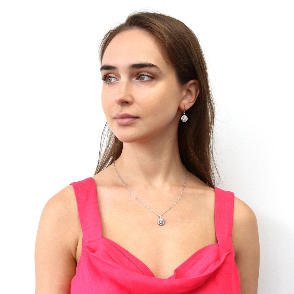 Model wearing Flower Woven CZ Fish Hook Dangle Earrings in Sterling Silver