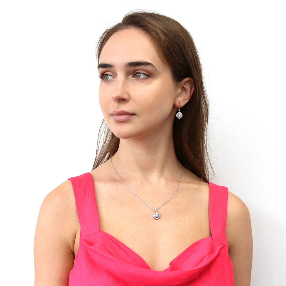 Model wearing Flower Halo CZ Necklace and Earrings Set in Sterling Silver