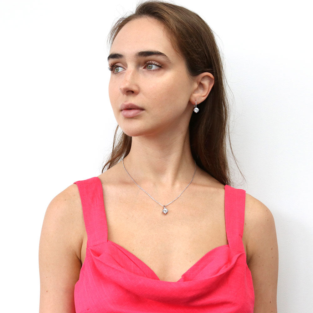 Model wearing Solitaire 4ct Round CZ Leverback Dangle Earrings in Sterling Silver