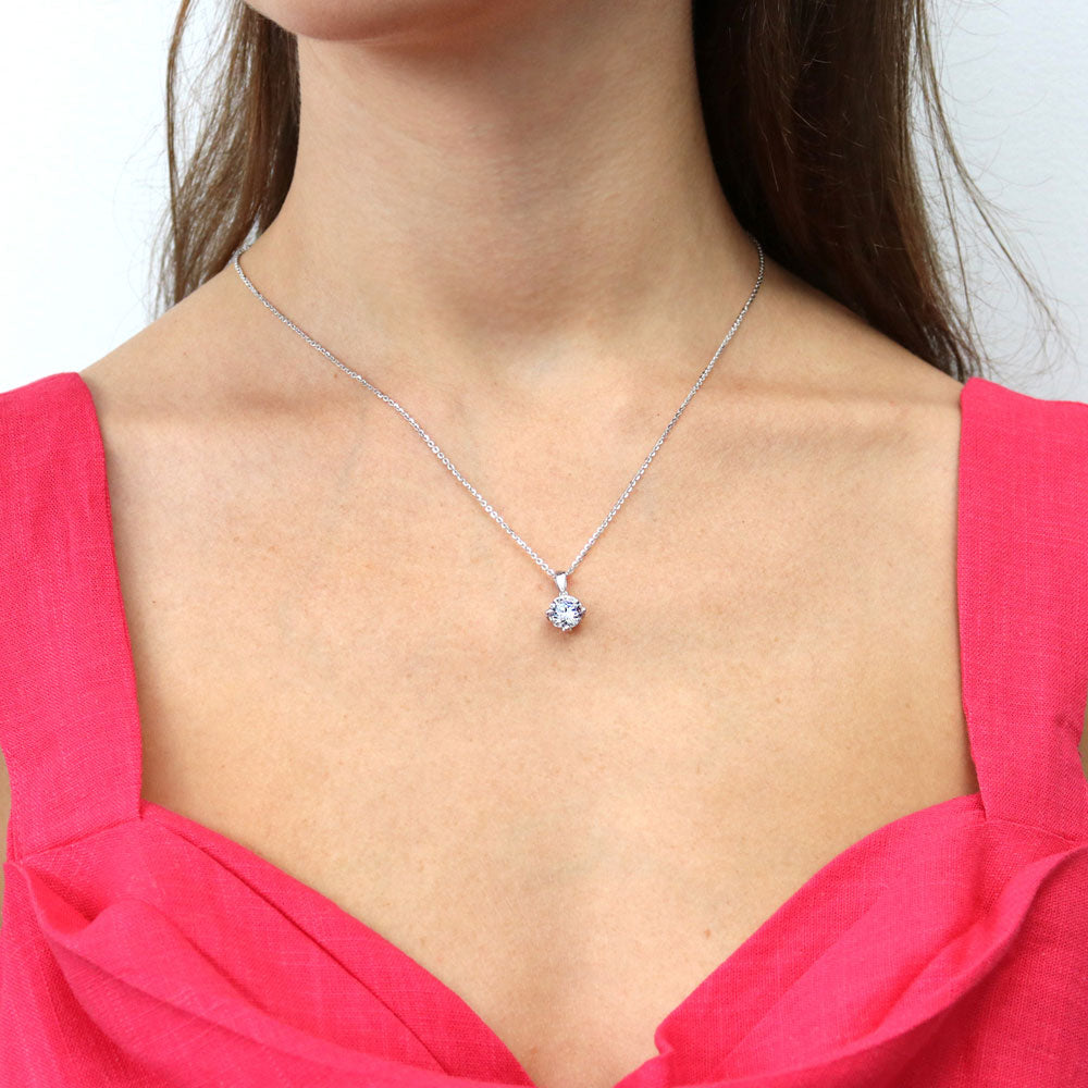Model wearing Solitaire Round CZ Necklace and Earrings Set in Sterling Silver