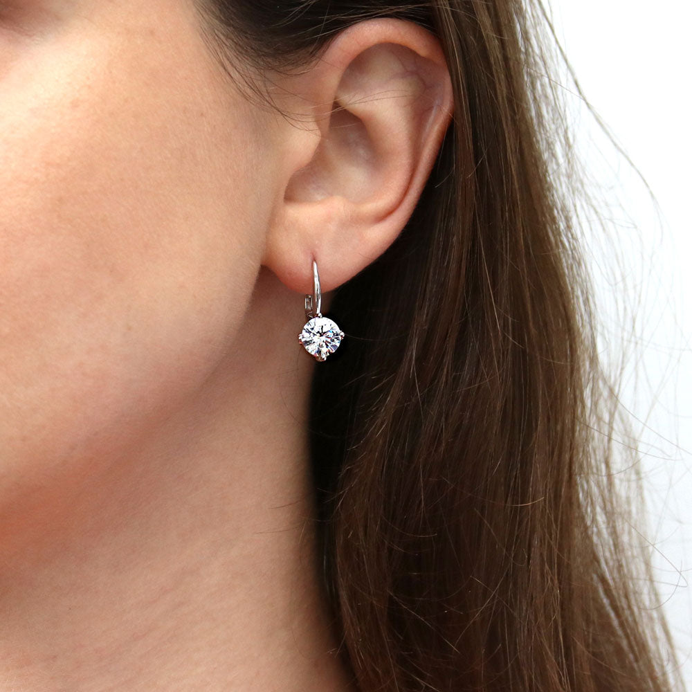 Model wearing Solitaire 4ct Round CZ Leverback Dangle Earrings in Sterling Silver