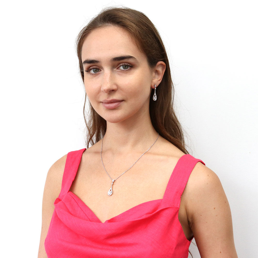 Model wearing Teardrop CZ Dangle Earrings in Sterling Silver