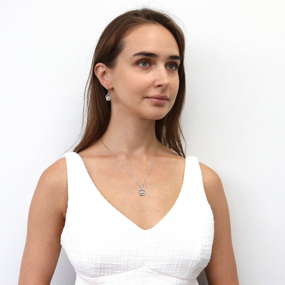 Model wearing Flower Imitation Pearl Fish Hook Dangle Earrings in Sterling Silver